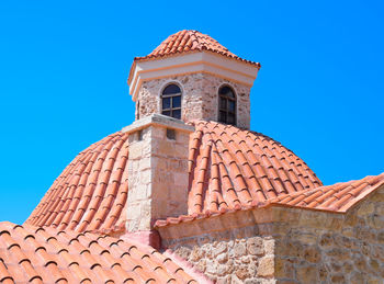 Low angle view of building against blue sky