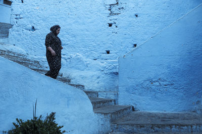 Woman standing in snow