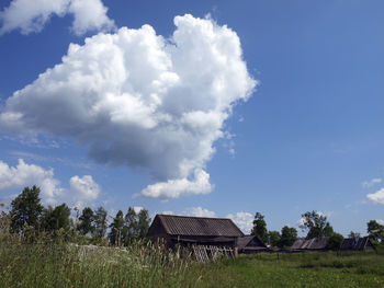 House on field against sky