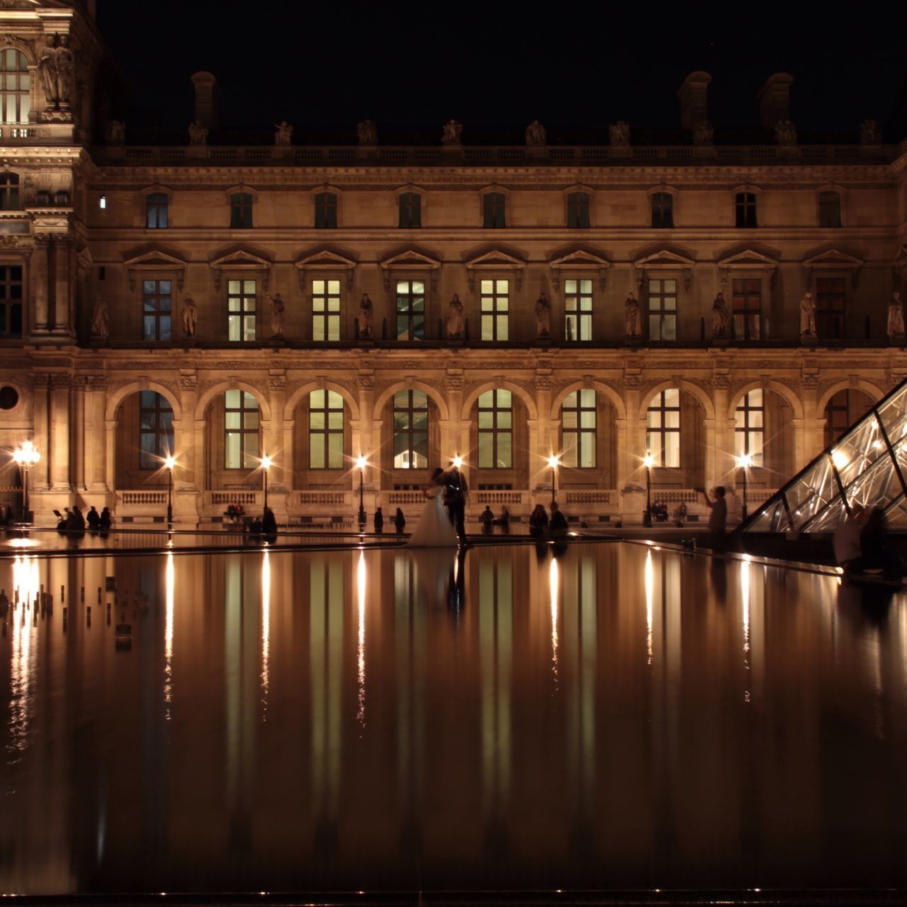 architecture, built structure, building exterior, illuminated, city, building, reflection, night, indoors, window, in a row, residential building, no people, residential structure, modern, sunlight, railing, city life, water