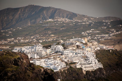 High angle shot of townscape against landscape