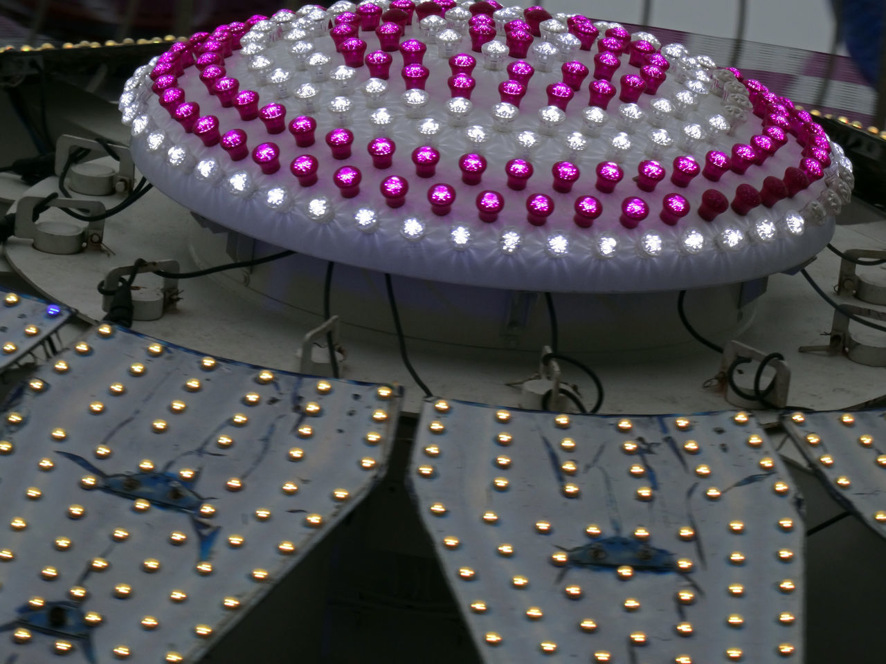 CLOSE-UP OF ILLUMINATED LIGHTING EQUIPMENT ON TABLE