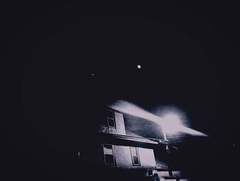 Low angle view of illuminated building at night