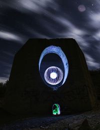 Low angle view of illuminated building against sky