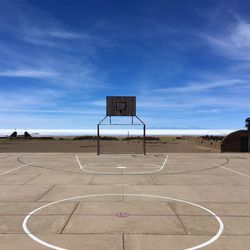 Basketball court against beach