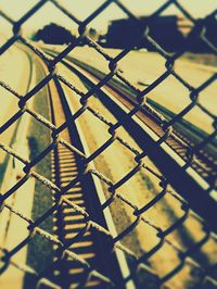 Full frame shot of chainlink fence against sky