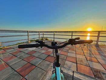 Scenic view of sea against clear sky during sunset