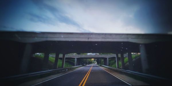 View of highway through car windshield