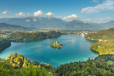 Scenic view of lake and mountains against sky