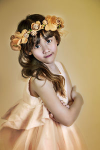 Portrait of a beautiful young woman against white background