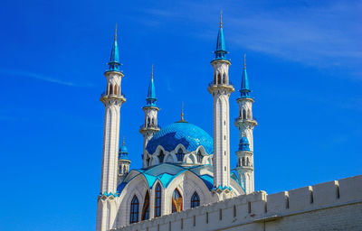 Low angle view of building against blue sky