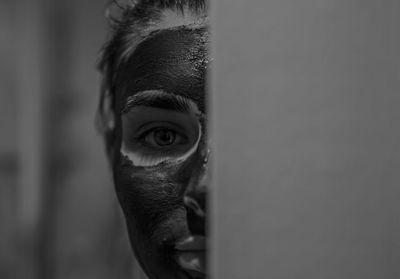 Close-up portrait of woman with facial mask