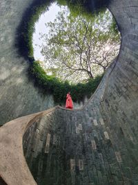 Woman at a spiral staircase