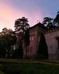 Built structure against sky during sunset