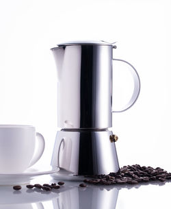 Close-up of coffee cup against white background