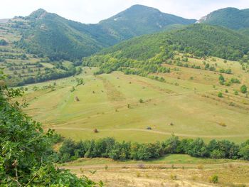 Scenic view of agricultural field against mountains