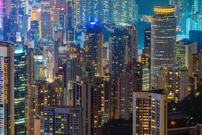 Aerial view of illuminated buildings in city at night