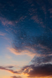 Low angle view of dramatic sky during sunset