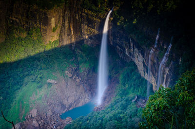 Scenic view of waterfall in forest