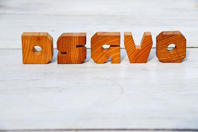 Close-up of wooden alphabets on table