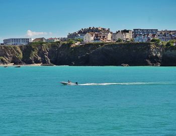 Scenic view of sea against blue sky