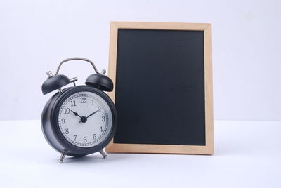 Close-up of clock on table