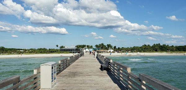 Pier over sea against sky