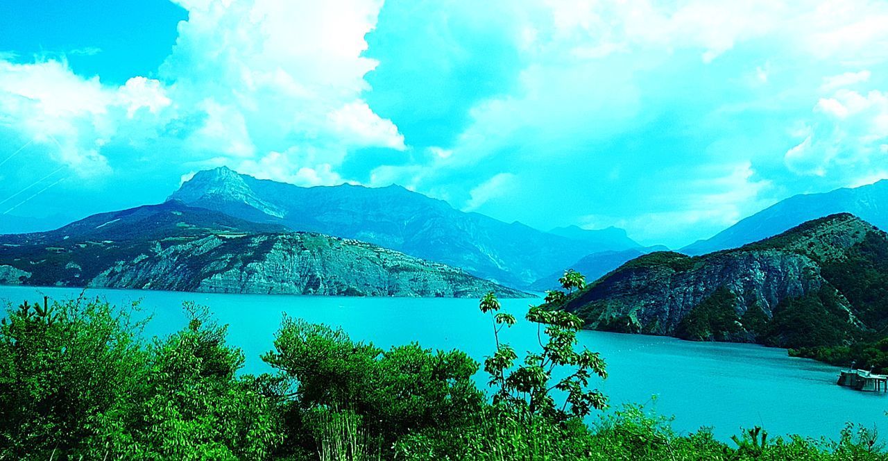 SCENIC VIEW OF LAKE AGAINST MOUNTAINS