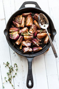 Caramelized roasted red onions in a cast iron skillet.