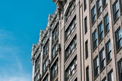 Low angle view of building against clear blue sky