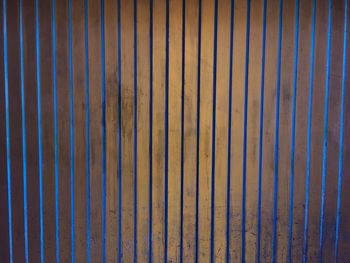 Full frame shot of wooden fence at night