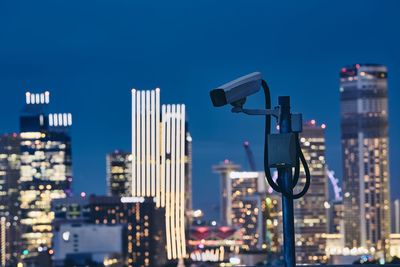 Security camera against buildings in city