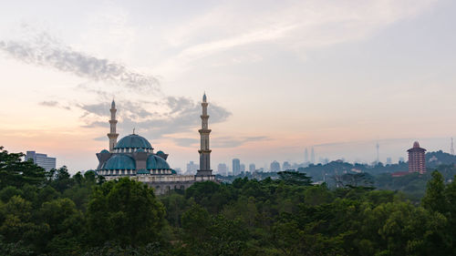 Federal territory mosque against sky during sunset