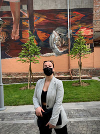 Full length of woman photographing plants