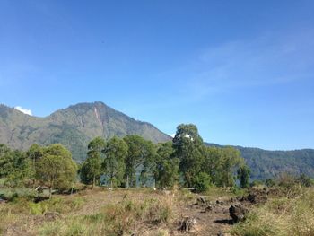 View of mountain range against blue sky