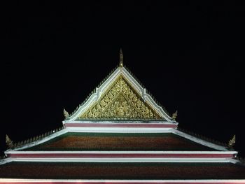 Low angle view of illuminated building at night