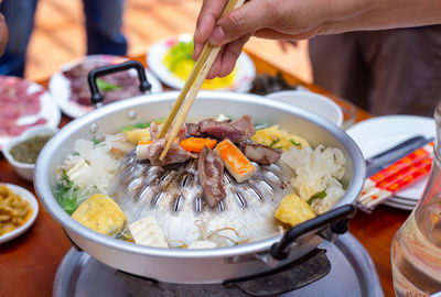 Midsection of man preparing food