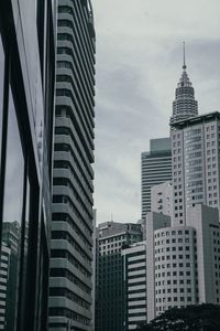 Low angle view of skyscrapers against sky