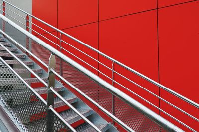 Metallic steps by red wall