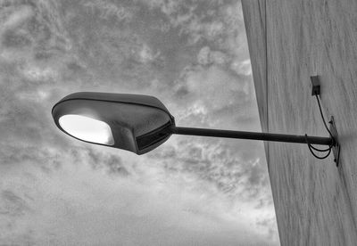 Low angle view of street light against sky