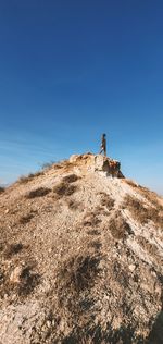 Low angle view of woman against clear sky