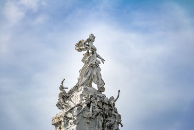 Low angle view of statue against sky