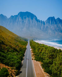 Road amidst mountains against sky