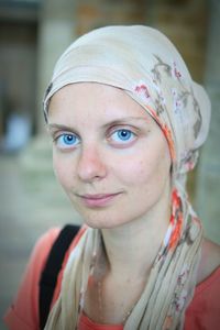 Close-up portrait of smiling young woman wearing headscarf