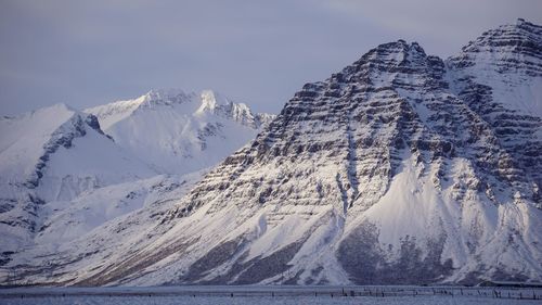 Scenic view of snowcapped mountains against sky