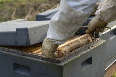 Low section of man working on wood