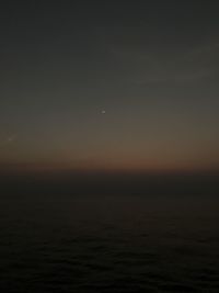 Scenic view of sea against sky at night