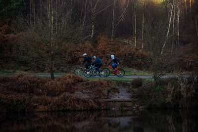 People riding bicycle in forest