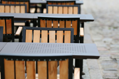 Close-up of empty chairs and tables in a restaurant