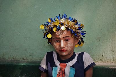 Portrait of boy against wall